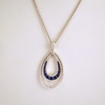 18k White gold Horseshoe pendant with 1.2cts of Blue Sapphires and 1.2cts of Diamonds